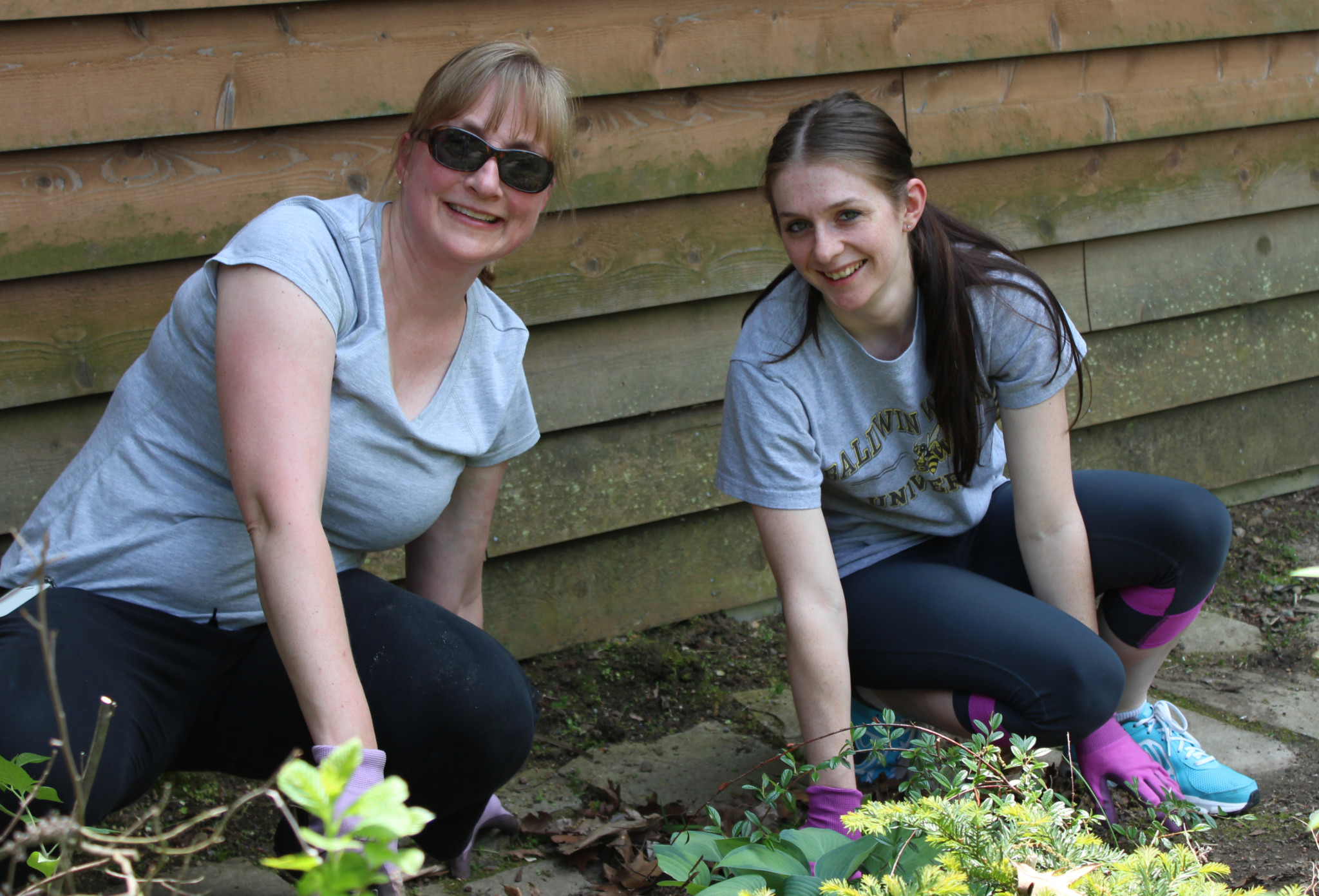 Christine and Gwyn working hard on the landscaping on Community Service Day.