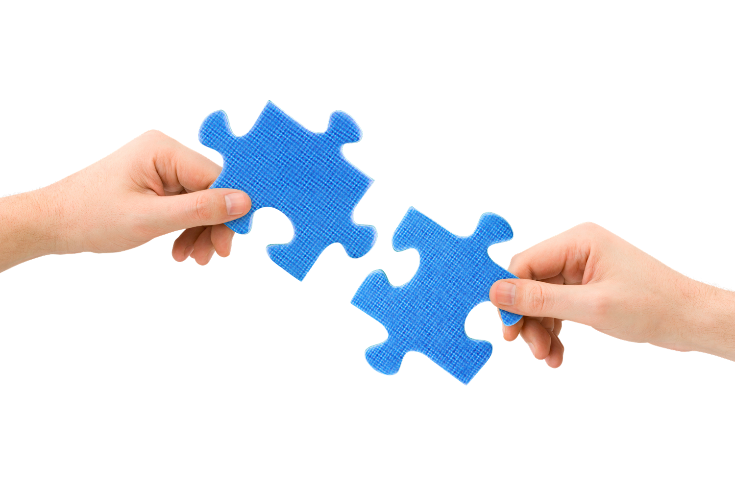 Photo of two hands holding conjoining blue puzzle pieces towards each other.